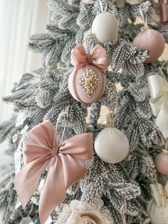 a christmas tree decorated with pink and white ornaments