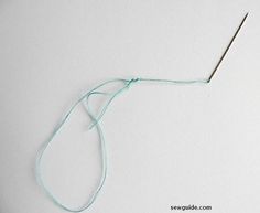 a needle is hooked up to the end of a piece of string