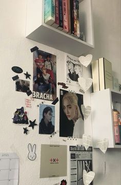 the wall is covered with pictures and magnets