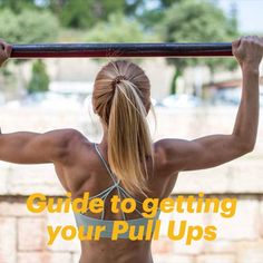 a woman doing pull ups with the words guide to getting your pull ups