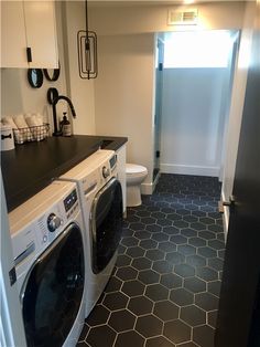 a washer and dryer in a small room