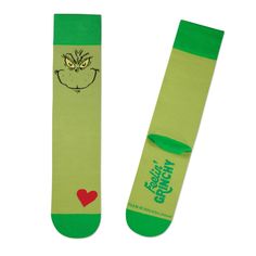 a pair of green socks with an angry grin face