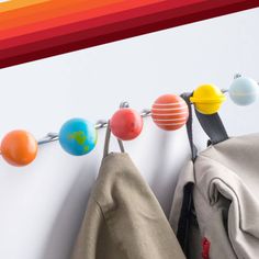 a coat rack that has some balls on it