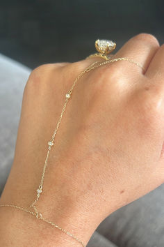 A 14k gold hand chain styled with a diamond ring Gold Hand Chain, Chain Diamond, Jewelry Accessories Ideas, Gold Hand, Accessories Ideas, Jewelry Lookbook, Hand Chain, Rose Yellow, Gold Hands