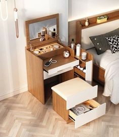 a bed room with a neatly made bed and a dressing table next to it on the floor