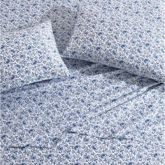 a blue and white floral print sheet set