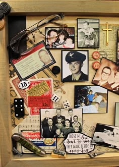 a wooden frame filled with pictures and other items