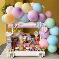 a table with balloons and other items on it