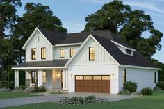 a white two story house with brown garage doors