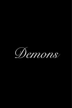 a black background with the word demonss written in cursive writing