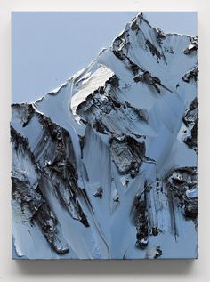 a piece of art that looks like a mountain is painted on the wall with blue and white paint