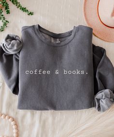 Embrace your two favorite things with this cozy 'Coffee and Books' sweatshirt. Perfect for slow mornings or curling up with a good read, it's the ideal piece for anyone who finds comfort in caffeine and a captivating story Materials & Fit: -100% ring-spun cotton -Light fabric -Relaxed fit -Check our size guide in the photos section to double-check your correct sizing. Care Instructions: -Wash on delicate cycle in cold water. -Please hang it to dry immediately after washing. -To prolong the lifes Book Apparel, Bookish Sweatshirts, Coffee Books, Couple Stuff, Gift For Book Lover, Cozy Coffee, Coffee Sweatshirt, Cute Shirt Designs, Coffee Lover Gift