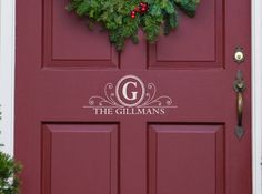 a red door with a wreath on it and the words the gillman's