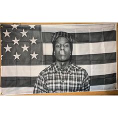 a man standing in front of an american flag with the image of him on it