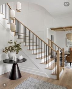 the stairs in this house are white and wood