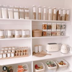 the shelves are filled with different types of food and containers on top of each shelf