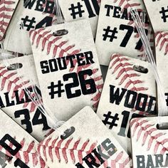 many tags with numbers and baseballs on them