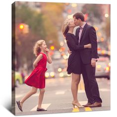 a man and woman kissing while crossing the street