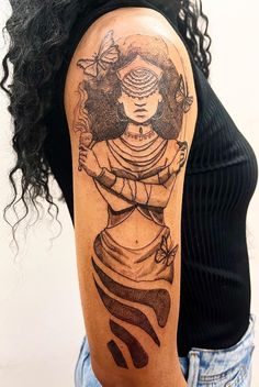 a woman with a tattoo on her arm