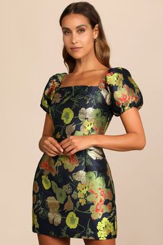 You'll leave 'em mesmerized when you show up in the Lulus So Stunning Navy Blue Floral Jacquard Puff Sleeve Mini Dress! Medium-weight jacquard fabric, with a colorful floral design and metallic lurex threading, shapes this glam dress that has a square neckline and puffy short sleeves with elastic at the shoulders and cuffs. A princess-seamed bodice tops an A-line mini skirt to complete the look. No-slip strips. Hidden back zipper/clasp. Fit: This garment fits true to size. Length: Above mid-thig Floral Dress Wedding Guest, Navy Blue Floral Dress, Dress With Puffy Sleeves, Dresses Lulus, Puff Sleeve Mini Dress, Lulus Dresses, Cocktail Attire, A Line Mini Skirt, Different Dresses