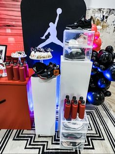 an assortment of items displayed in front of a backdrop at a basketball themed birthday party