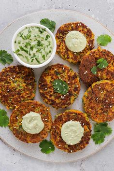 some food is sitting on a plate with sauce and cilantro garnish