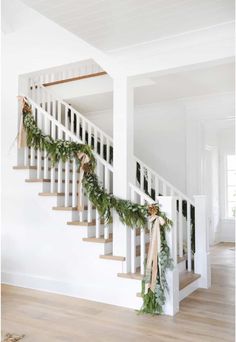 the stairs are decorated with greenery and pine cones for garlands to hang on