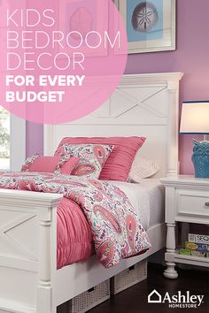 a bed room with a neatly made bed and pink walls