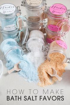 there are many small jars with different types of powder in them on the table together