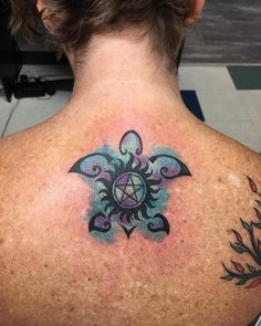 a person with a tattoo on their back