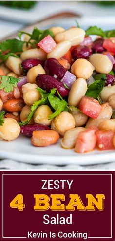 a white plate topped with beans and veggies next to a red sign that says zesty 4 bean salad