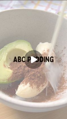 a bowl filled with food sitting on top of a wooden table