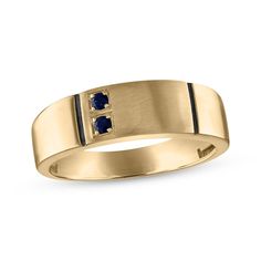 a yellow gold ring with blue sapphire stones