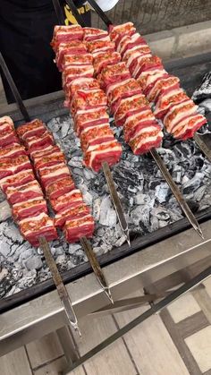 there are many skewers that have meat on them