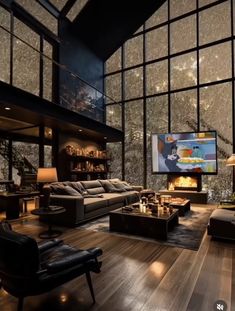 a large living room with lots of windows and couches in front of a flat screen tv