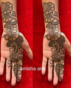 two hands with henna tattoos on them, one is showing off the intricate design