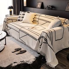 a living room with black and white decor