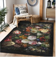 a large rug with flowers on it in a room next to a chair and potted plant