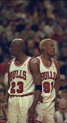 two basketball players standing next to each other