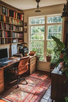 a room with a desk, computer and bookshelf filled with lots of books