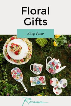 floral gifts are on display in the grass, with flowers around them and an assortment of dishes