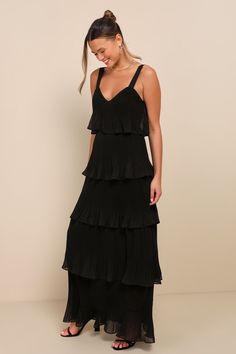 You'll elevate your charming character whenever you slip into the Lulus Elegant Nature Black Pleated Sleeveless Tiered Maxi Dress! Lightweight, pleated woven chiffon shapes a sleeveless bodice, a flirty V-neck (and back), and wide tank straps. The figure-skimming, sheath-style silhouette cascades down to a sweeping maxi hem. Hidden back zipper/clasp. Fit: This garment fits true to size. Length: Floor length. Size medium measures 61" from shoulder to hem. Bust: Great for any cup size. Waist: Fitt Fall Wedding Outfits, Black Tiered Dress, Fall Wedding Guest Dress, Eve Dresses, New Years Eve Dresses, Black Bridesmaid Dresses, Retro Clothing, Pleated Maxi Dress, Summer Dress Outfits