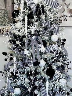 a decorated christmas tree with black and white decorations