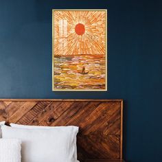 a bedroom with blue walls and white bedding has a painting above the headboard