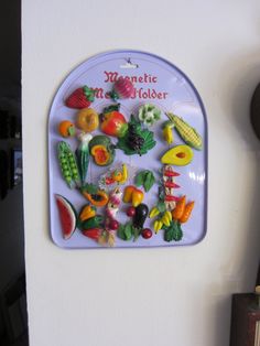 there is a magnet with many different fruits and vegetables on it