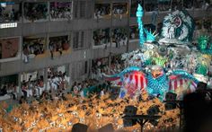 an elaborate float in the middle of a crowd