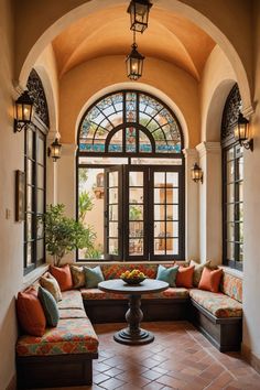 a living room filled with lots of furniture next to a large arched window on top of a wall