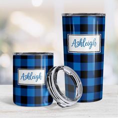 two blue plaid tumblers with the name ashlight printed on one side and an ashlight engraved on the other