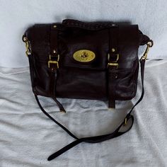 Mulberry Alexa Tote In Dark Brown Leather. I Think The Leather Finish Is The Soft Buffalo. Approximately 14.5" At Base, 5.5 Deep, 11" Tall. Will Fit 14" Laptop. Gold Hardware, Top Handle And Detachable Crossbody Strap, Postman, And Magnetic Closures. Fully Lined In Signature Fabric With Zipper Pocket And One Open Pocket. Good Condition. No Rips Or Tears To Leather. Some Wear To Corners And All Over Softing Of Leather That Gives These Bags That Wonderful Broken In Vintage Feel. Some Feathering Of Stitching On Handle. Significant Discoloration To Hardware, Especially On Postmans Lock. This Is Very Common With These Bags And Unavoidable. I Have Several Mulberry Bags, And This Has Happen Mulberry Alexa, Mulberry Bags, Mulberry Bag, Leather Finish, Dark Brown Leather, Crossbody Strap, Gold Hardware, Top Handle, Zipper Pocket