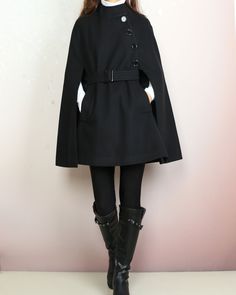 * A cool and long woolen cape coat, very elegant. * With black buttons and fully lined with lining. * Material: 50% wool, 50% polyester. Shop sizing chart FYI ( actual body figures, not laying flat clothes measurements) Size XS (US 2, UK 6, German 32, French 34) Bust: fits bust around 33.5 inches/85cm Waist: fits waist around 26 inches/66cm Hips: fits hips around 36 inches/91cm Size S (US 6, UK 10, German 36, French 38) Bust: fits bust around 35.5 inches/90cm Waist: fits waist around 28 inches/7 Chic Black A-line Outerwear, Black Cape Poncho For Work, Black Workwear Poncho Cape, Chic Black Cape For Fall, Chic Black Fall Cape, Black Workwear Cape, Black Wool Poncho For Winter, Black Wool Poncho For Fall, Wool Black Poncho For Fall